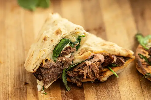 Greek-Inspired Roast Beef Quesadillas with Spinach, Feta & Yogurt-Harissa Sauce