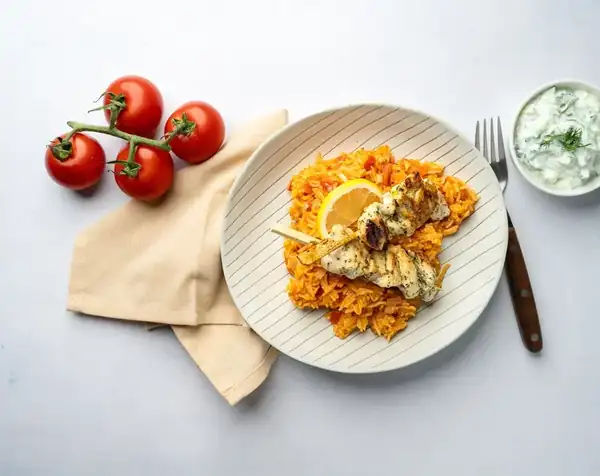 Tomato rice with chicken souvlaki