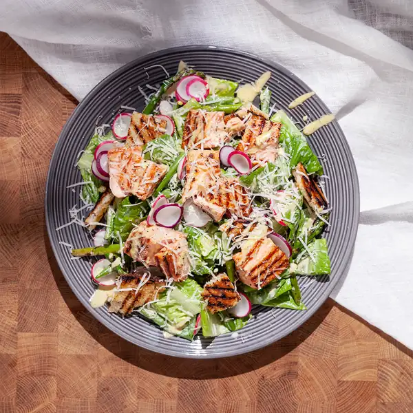 Caesar salad with grilled salmon