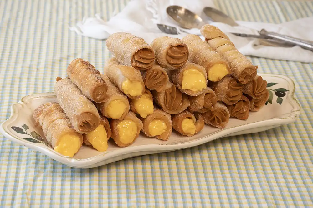 Canes filled with two creams: a traditional Galician recipe, crispy and delicious