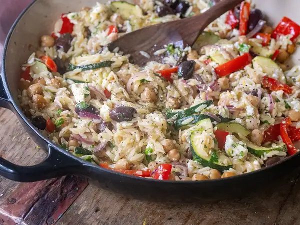 Warm rice salad with feta cheese and olives