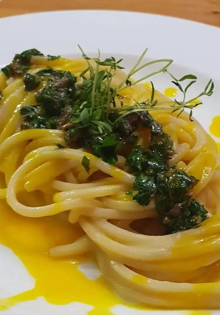 Spaghetti with potato cream and saffron reduction