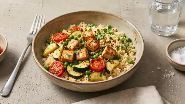 Quick couscous bowl with fried tofu and vegetables