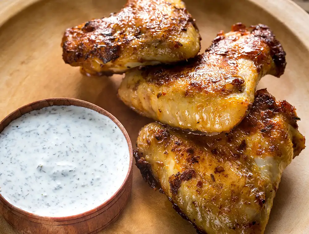 Smoky, Crispy Chicken Thighs with Alabama White Barbecue Sauce