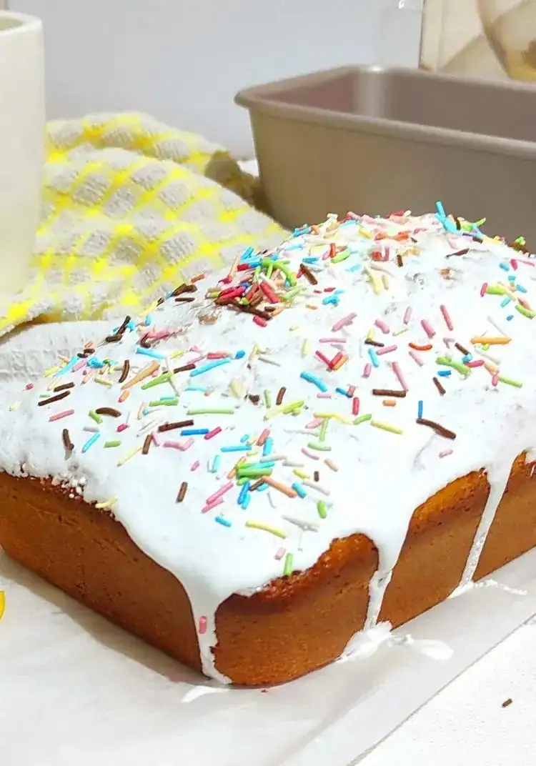 Lemon plum cake with vanilla glaze