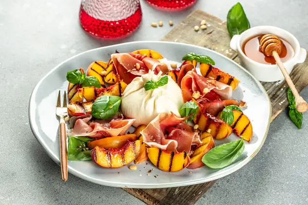 Fresh peach salad with burrata