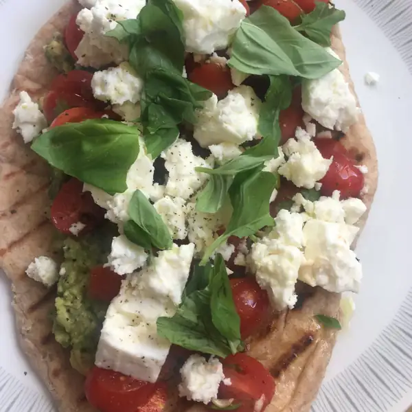 Breakfast flatbread with avocado, tomato salsa and feta