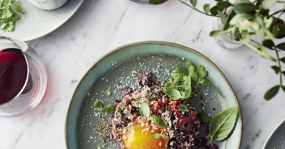 Spicy tartare and scrambled egg yolks