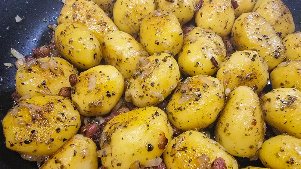 Country potatoes with bacon, onion and black pepper