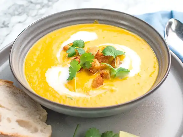 Roasted carrot soup with coconut milk, ginger and croutons