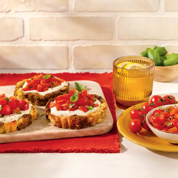 Potato crust tartlets with whipped feta and tomatoes