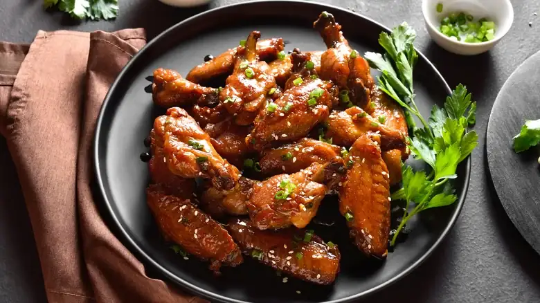The Flavor Pitfall To Watch Out For When Cooking Chicken Wings With Baking Soda