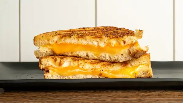 The Crunchy Breakfast Item That Will Take Your Grilled Cheese To The Next Level