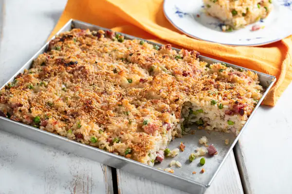 Cheesy Baked Rice with Peas and Speck
