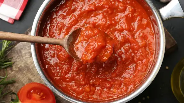 Why Marcella Hazan's Famous Tomato Sauce Calls For Half An Onion, Not Diced