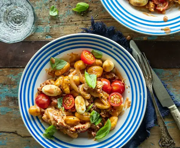 Crispy gnocchi with creamy tomato sauce and salsiccia