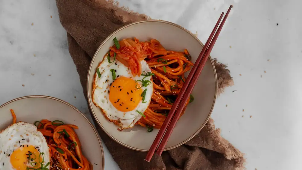 You can have these cheesy kimchi noodles on the table in 15 minutes