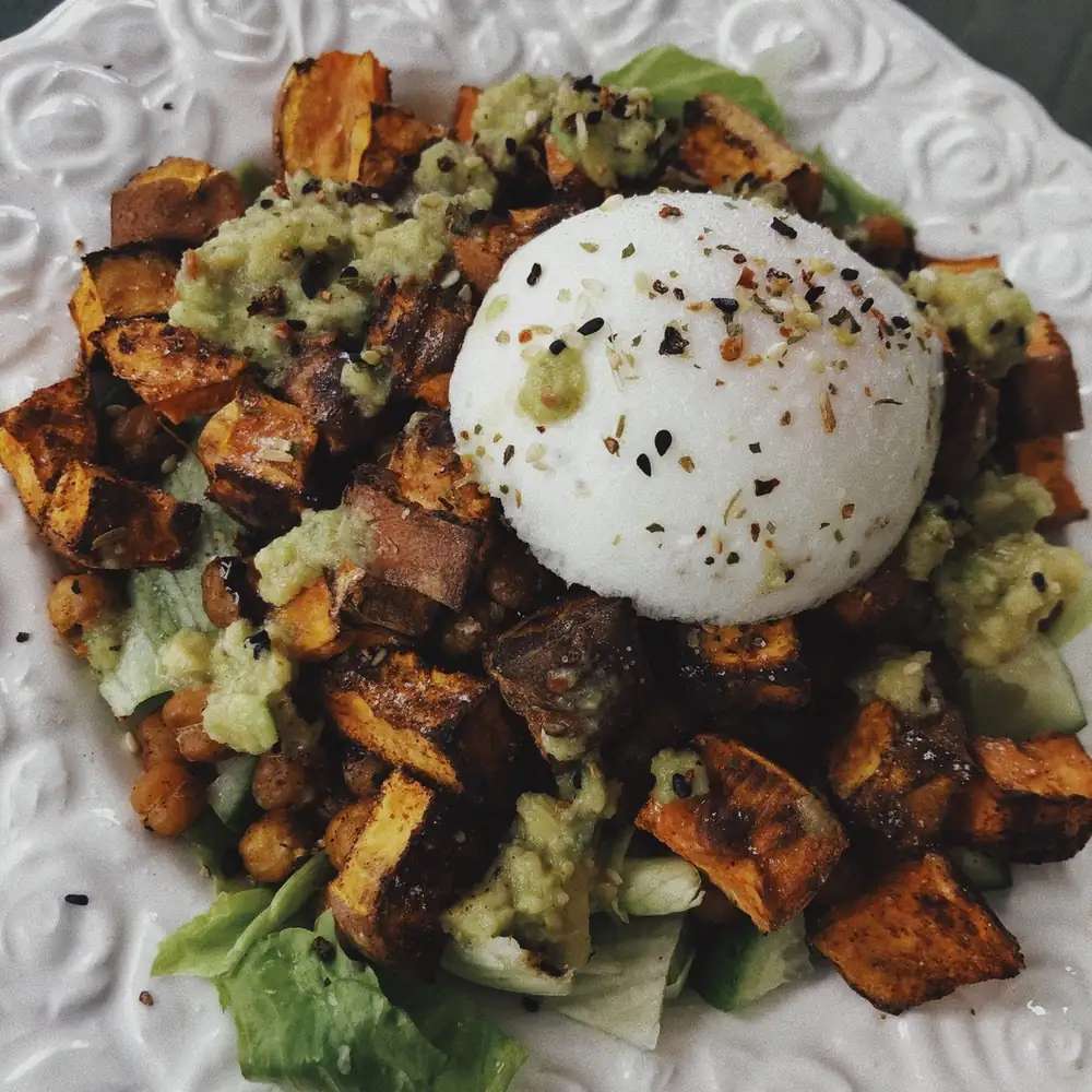 Sweet potato and chickpea salad with egg and avocado