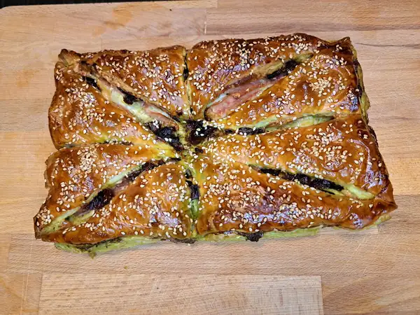 Puff pastry pocket with pesto and tomatoes