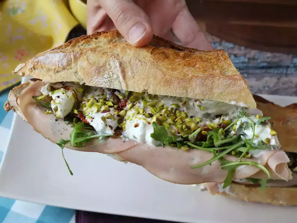 Italian sandwich with mortadella, burrata and pesto