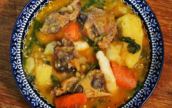 Hearty Caribbean Oxtail Soup with Root Vegetables and Dumplings