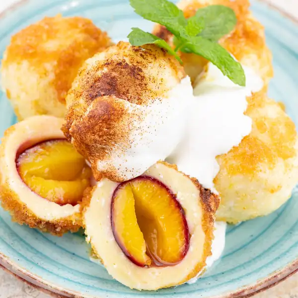 Cheese dumplings with plums
