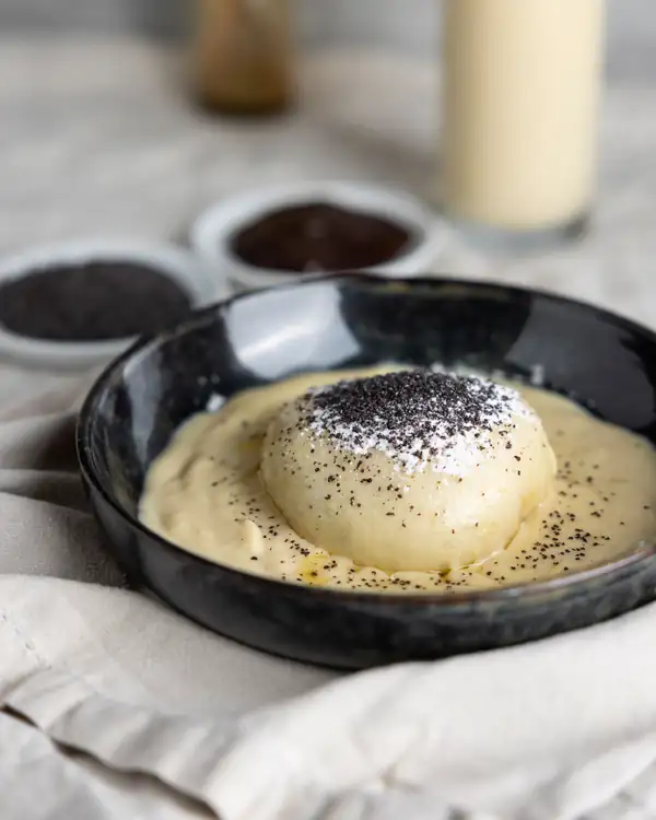 Yeast dumplings with plum jam & vanilla sauce