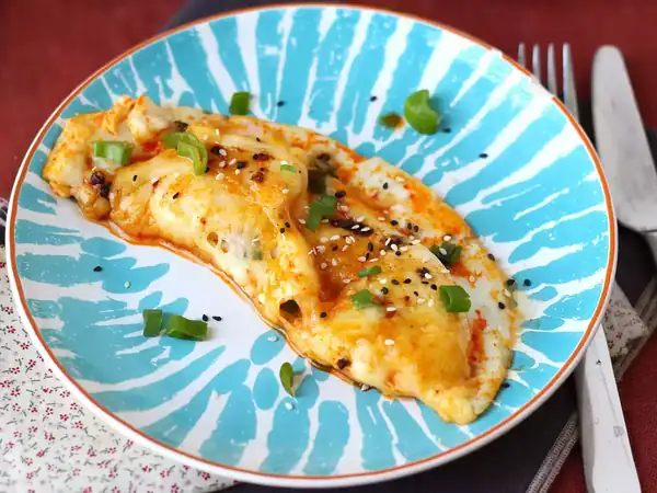 Fried eggs folded with melted mozzarella, honey and a spicy touch
