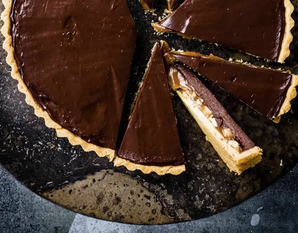 Snickers chocolate cake with caramel and peanuts