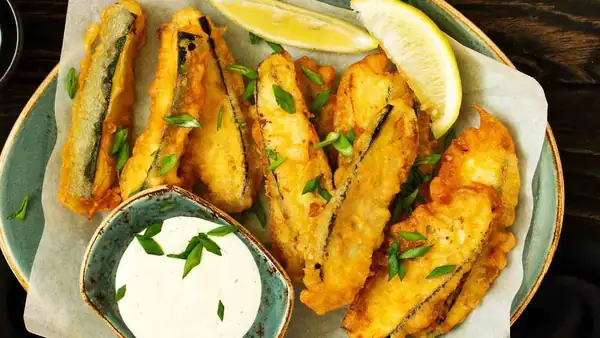 But why do you fry the courgettes in that batter that makes them soggy? Halve the flour, add this and see how light it becomes