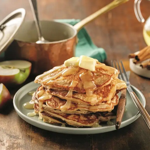 Apple pancakes with apple juice and maple syrup sauce