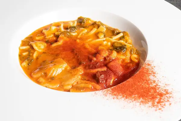 Mixed pasta with Vesuvius tomato cream, stockfish, seaweed and smoked pepper