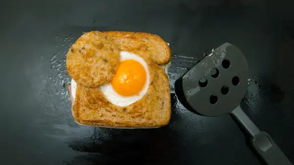 Egg-In-A-Hole Grilled Cheese Is The Upgrade Your Sandwich Deserves