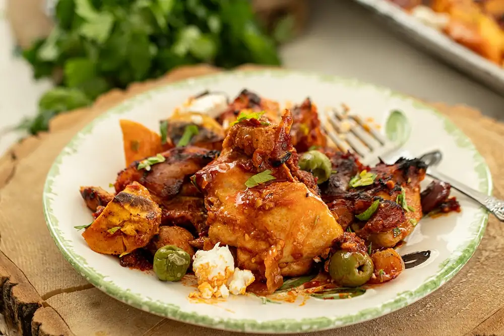 Honey Harissa Sheet Pan Chicken with Sweet Potatoes, Feta, and Olives