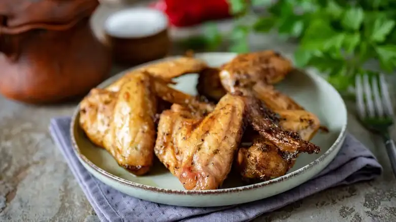 For The Crispiest Oven-Baked Chicken Wings, Don't Forget The Butter
