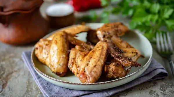 For The Crispiest Oven-Baked Chicken Wings, Don't Forget The Butter