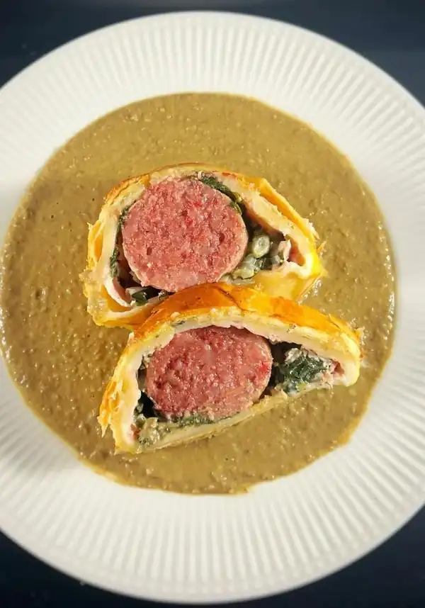 Crusted Cotechino on Lentil Cream