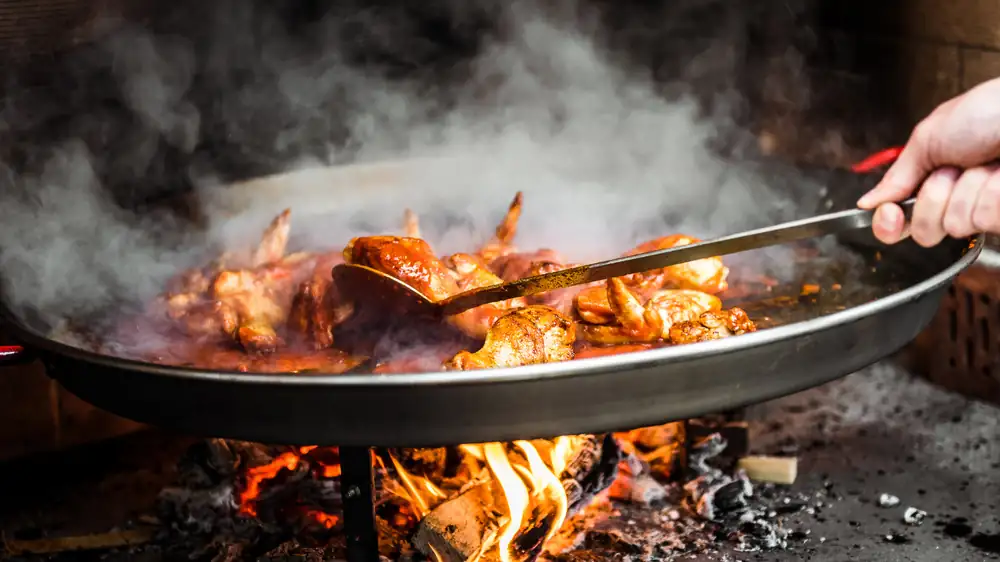 These Are Andrew Zimmern's Top Three Tips To Be A Great Cook