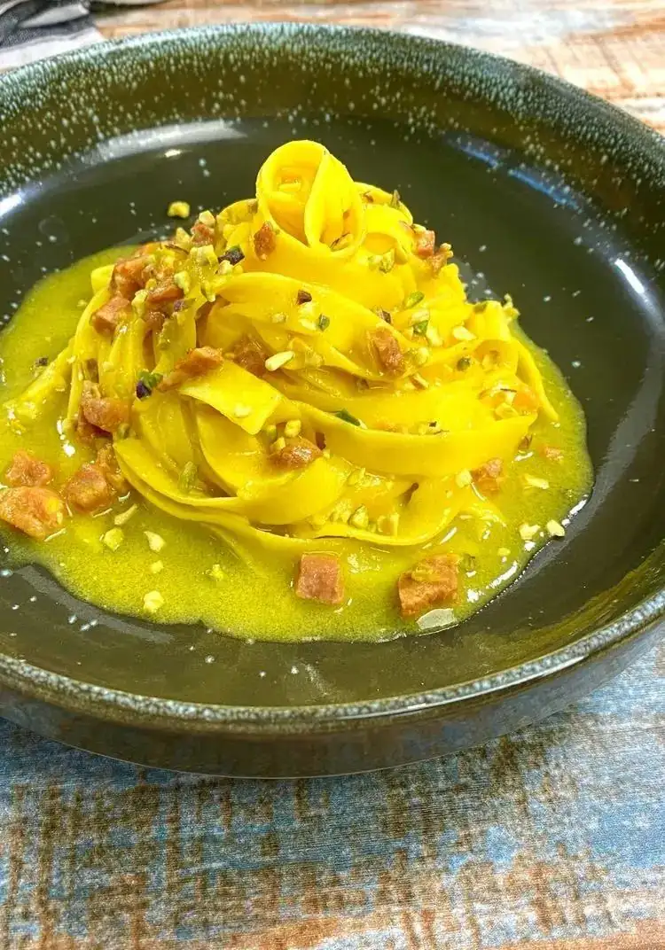 Fettuccine with sausage, saffron, and pistachio