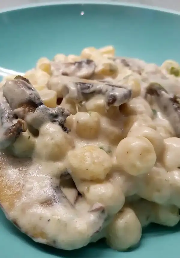 Creamy potato dumplings with mushrooms