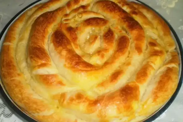 Homemade twisted banitsa with butter