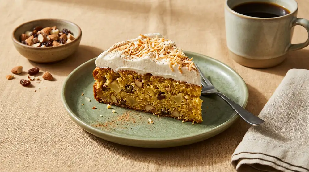 Moist apple and almond cake with a whipped cream topping