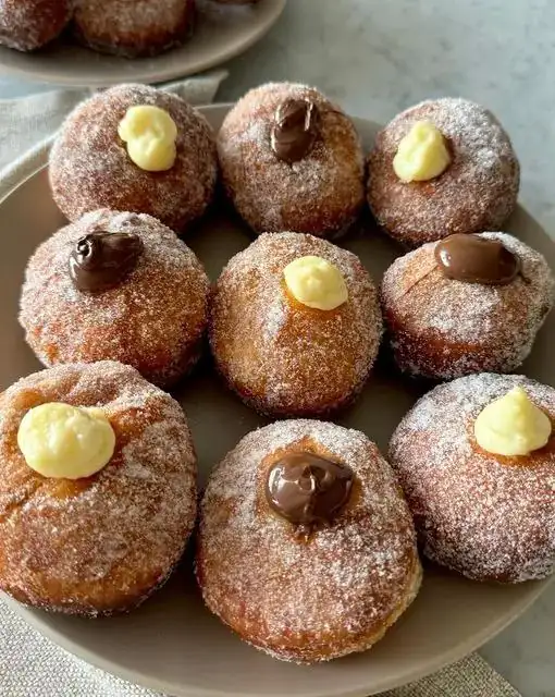 Fried doughnuts filled with custard and Nutella 🎊