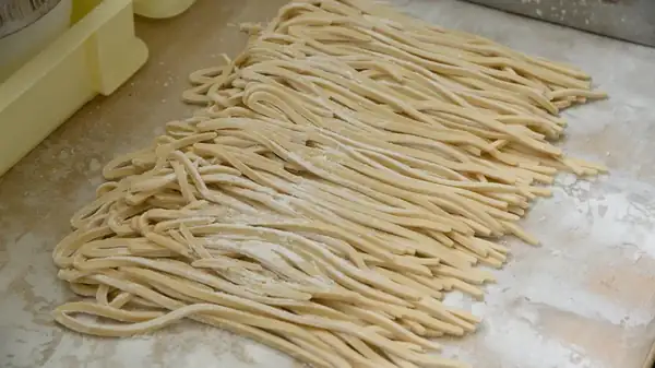 The Single Ingredient That Transforms Noodle Dough From Stretchy To Snappy
