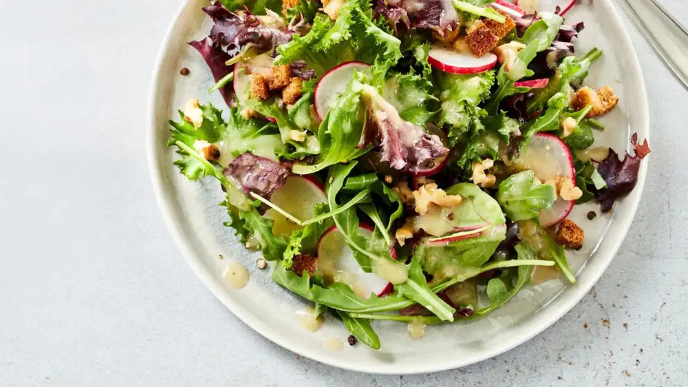 Salad with potato dressing and croutons