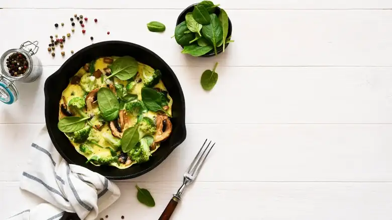 Scramble That Leftover Salad With Eggs For An Easy Breakfast Switch-Up