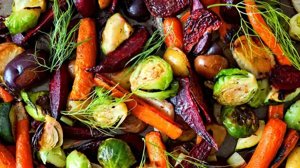 You're Tossing Oil On Your Roasted Vegetables At The Wrong Time
