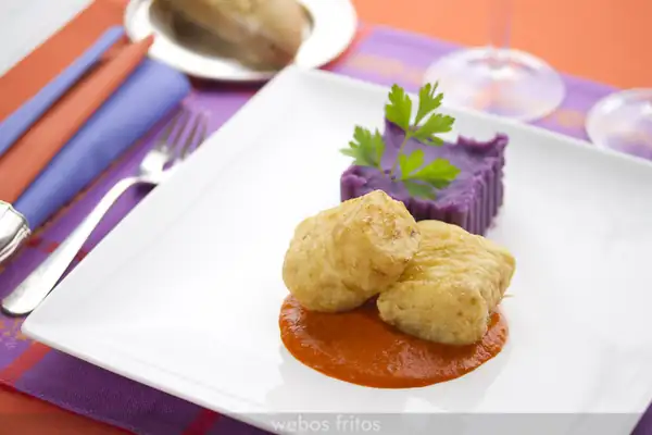 Breaded cod with tomato and pepper sauce