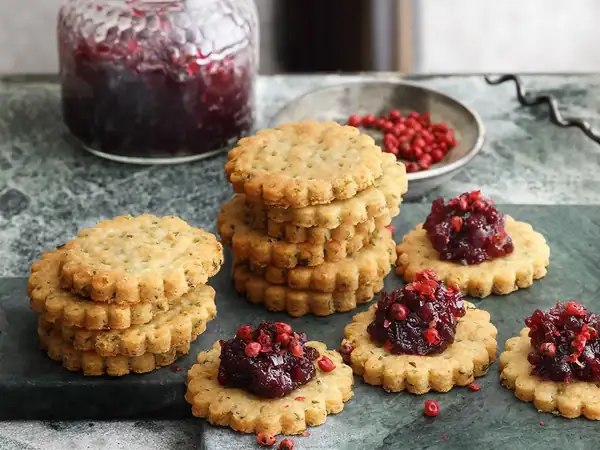 Cheese and herb crackers with port wine and onion marmalade