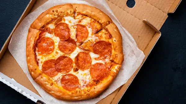 What The Paper In Your Pizza Box Is And Why It's In There
